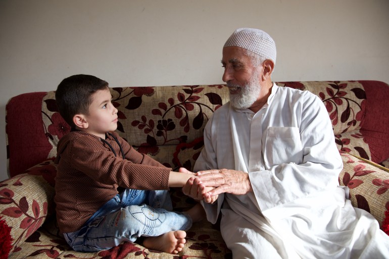 An elderly man and a child in Idlib, Syria