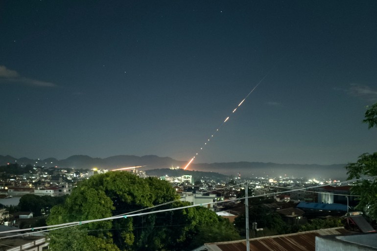 A missile fired from a Myanmar military base in Lashio township, northern Shan State. It's night time. The missile is streaking through the sky.