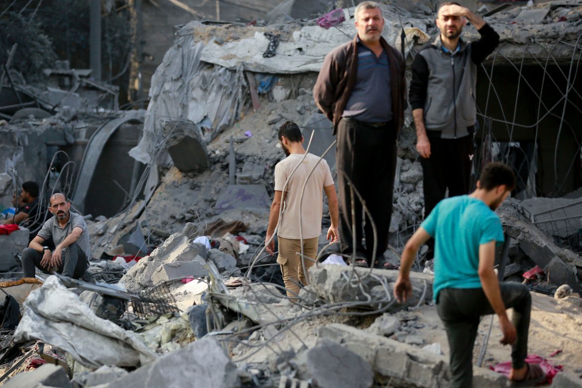 Palestinians check the destruction in the aftermath of an Israeli strike in the Jabalia camp for Palestinian refugees in the Gaza Strip.