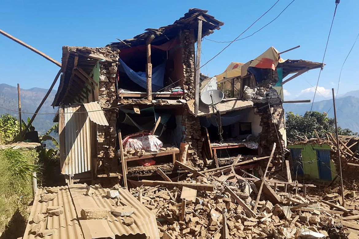 Damaged houses lie in ruins, in the aftermath of an earthquake at Pipaldanda village of Jajarkot district on November 4