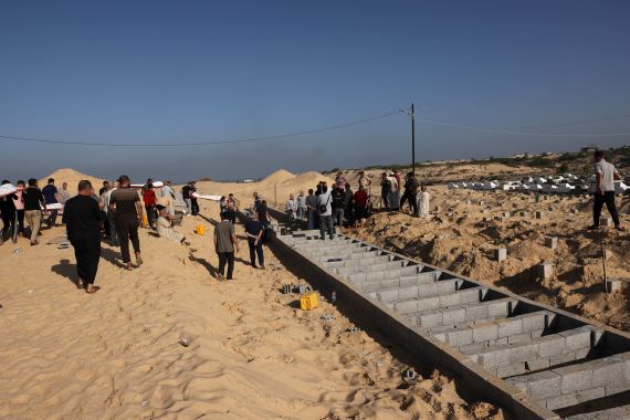 Graves are prepared at a cemetery in Rafah in the southern Gaza Strip on November 6