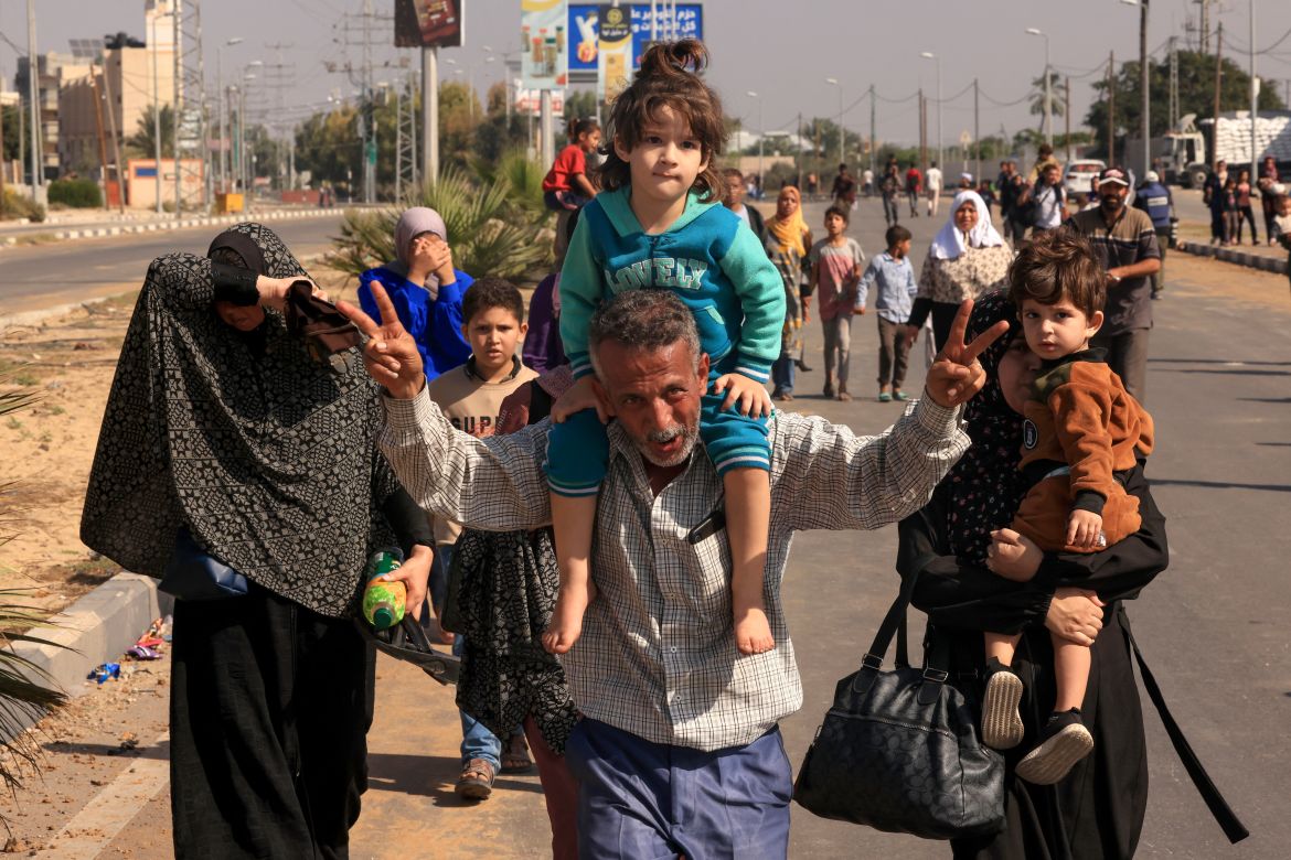 Palestinians fleeing Gaza City towards the southern areas walk on a road on November 7, 2023, amid the ongoing battles between Israel and the Palestinian Islamist group Hamas.