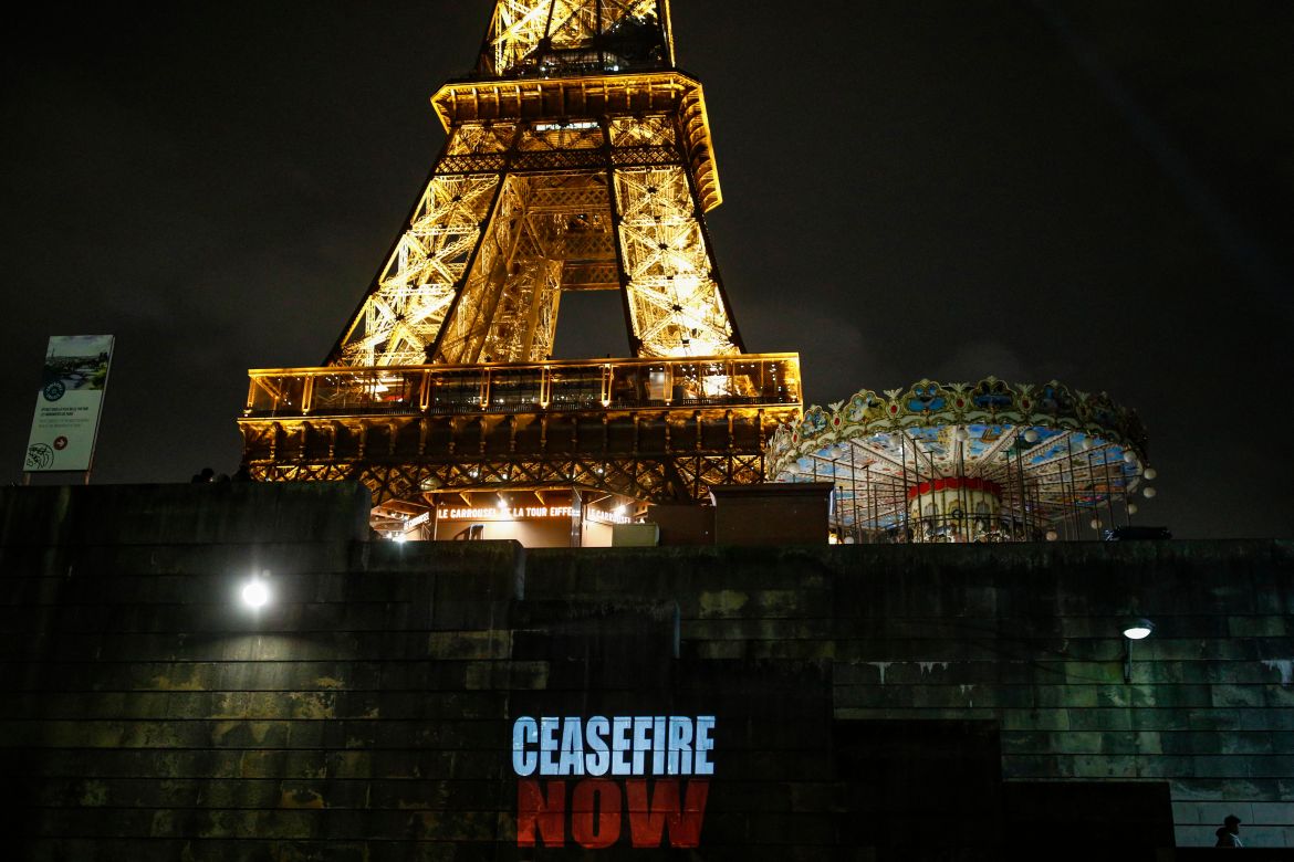 The slogan "Ceasefire Now" is projected on a wall along the Seine river bank at the foot of the Eiffel tower, as part of an initiative by NGO organizations including Amnesty International, Oxfam, Medecins Sans Frontieres (MSF), and others, in Paris.