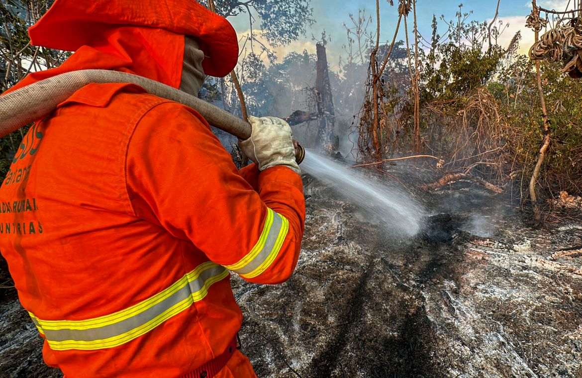 A firefighter extinguishes a fire in the Pantanal wetland in Porto Jofre, Mato Grosso State, Brazil.