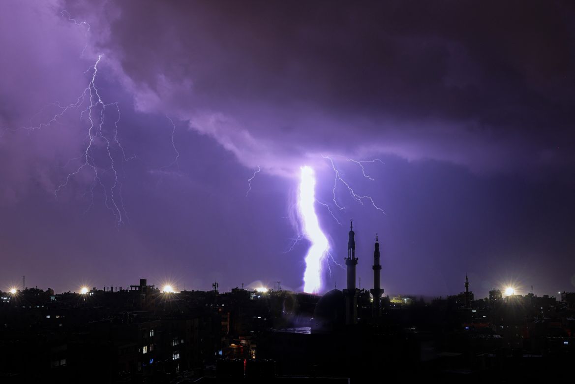 Lightening illuminates the sky during a storm over Rafah in the southern Gaza Strip on November 14