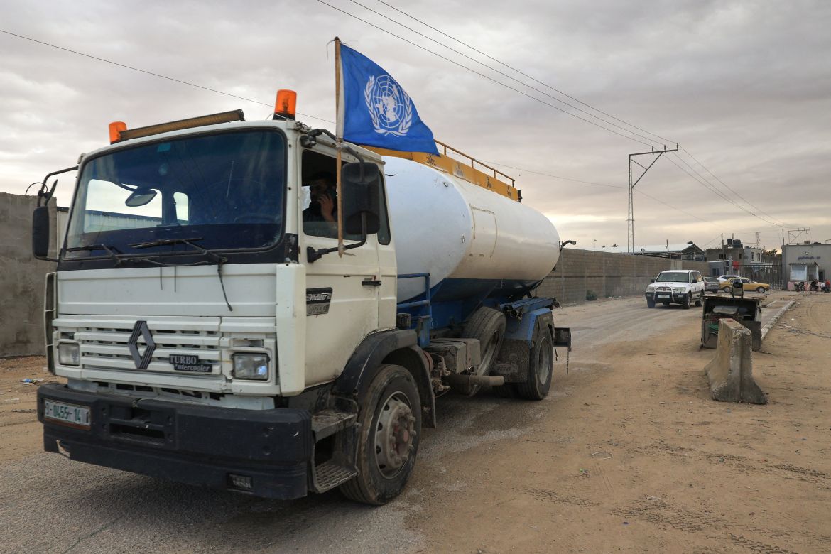 A truck carrying fuel decorated with a UN flag crosses into Rafah in the southern Gaza Strip.