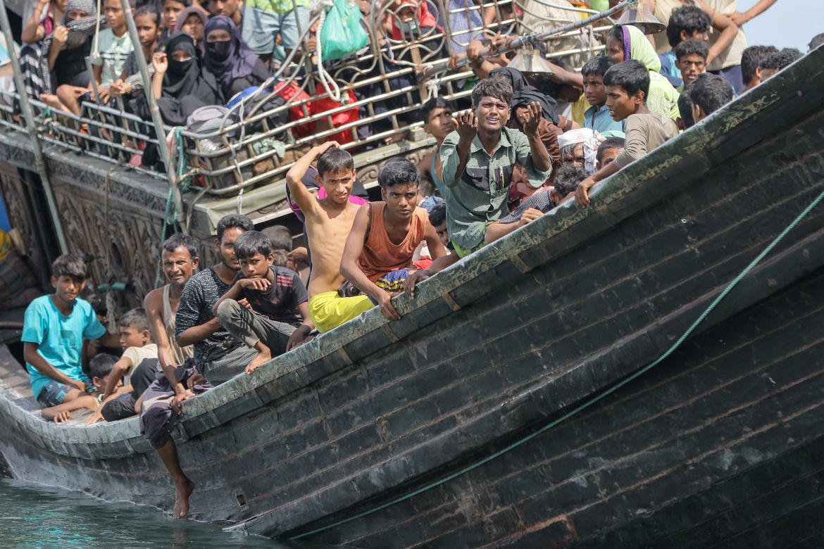 Newly arrived Rohingya refugees are stranded on a boat as the nearby community decided not to allow them to land after providing water and food in Pineung, Aceh province.