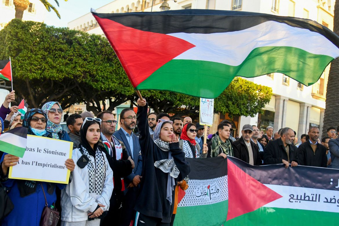 Demonstrators chant slogans and wave Palestinian flags during a protest in solidarity with the Palestinian people in the Israeli occupied West Bank and the Gaza Strip in the Moroccan capital Rabat.