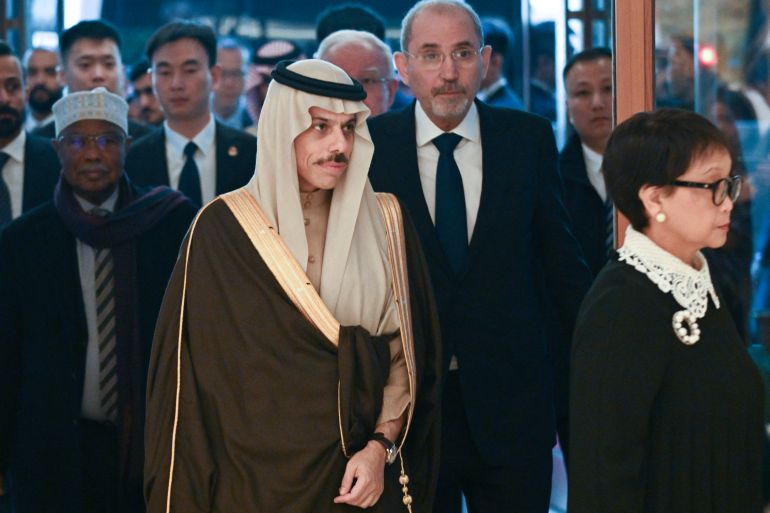 Saudi Arabia's Foreign Minister Prince Faisal bin Farhan Al-Saud (C) arrives to a meeting with China's Foreign Minister Wang Yi and foreign ministers from Arab and Muslim-majority nations at the Diaoyutai State Guest House in Beijing on November 20, 2023. - The international community must take urgent action to stop the "humanitarian disaster" unfolding in Gaza, Chinese Foreign Minister Wang Yi told visiting diplomats from Arab and Muslim-majority nations on November 20. (Photo by Pedro PARDO / AFP)