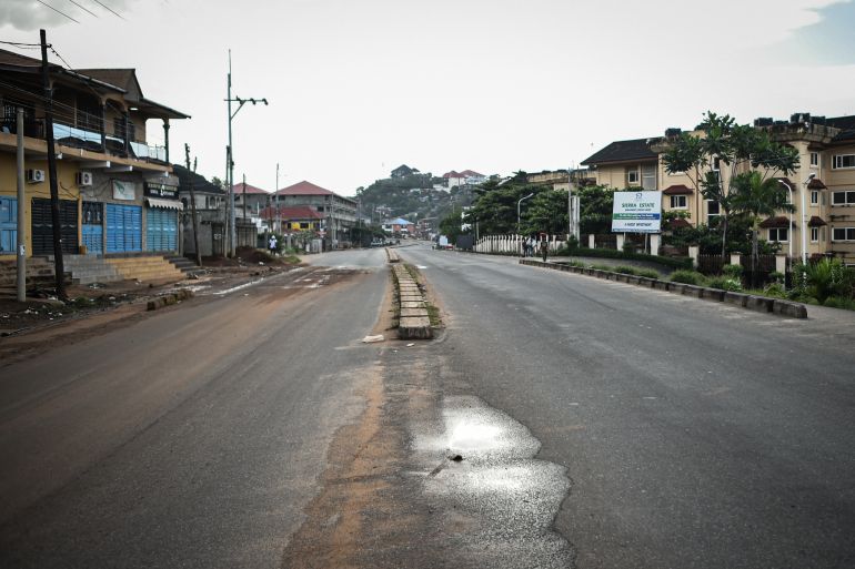 An empty road is pictured in Freetown on November 26, 2023 - A military armoury in Sierra Leone's capital Freetown came under attack on Sunday, the government said, as it imposed an immediate national curfew. (Photo by Saidu BAH / AFP)