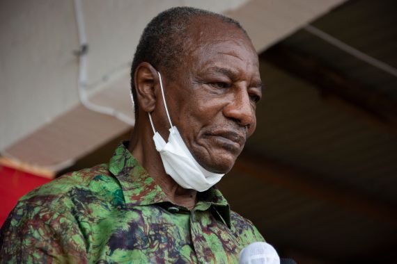 Guinea President Alpha Conde addresses his supporters during a campaign rally in Kissidougou on October 12, 2020. Presidential elections are to be held on October 18, 2020, with incumbent President bidding for a third term in office, defying critics who say he forced through a new constitution this year enabling him to sidestep two-term presidential limits. (Photo by CAROL VALADE / AFP)