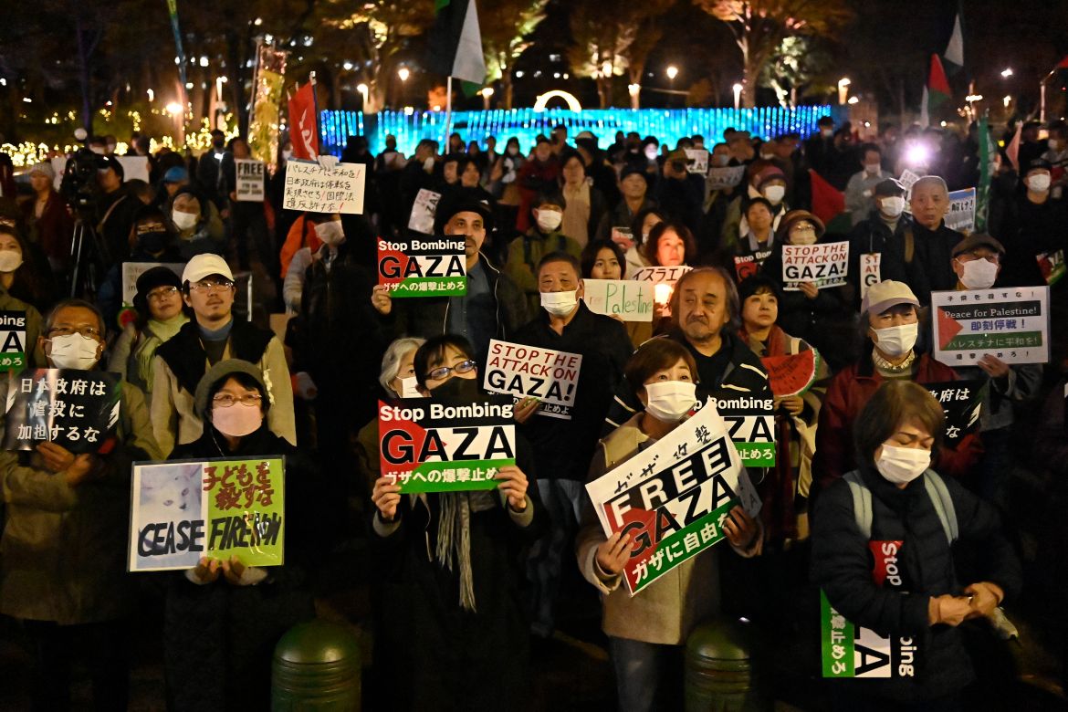 People gather and demonstrate on the street asking the stop of war in Gaza and to express their solidarity with Palestinian people as part of the International Day of Solidarity with the Palestinian People, in Tokyo, Japan.