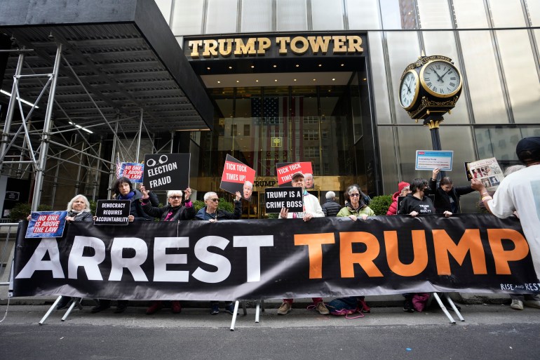 FILE - Protesters gather outside Trump Tower in New York on Friday, March 31, 2023.  Former President Donald Trump was indicted the day before by a grand jury in Manhattan, a historic reckoning after years of investigations into his personal, political and business dealings and an abrupt jolt in his bid to retake the White House.