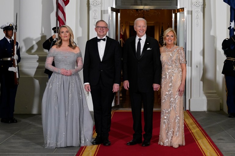 President Joe Biden and first lady Jill Biden welcome Australian Prime Minister Anthony Albanese and his partner Jodie Haydon at the White House. They're wearing evening dress.