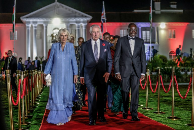 Britain's King Charles III, center, Queen Camilla and Kenyan President William Ruto, right, arrive for the State Banquet at the State House in Nairobi, Kenya