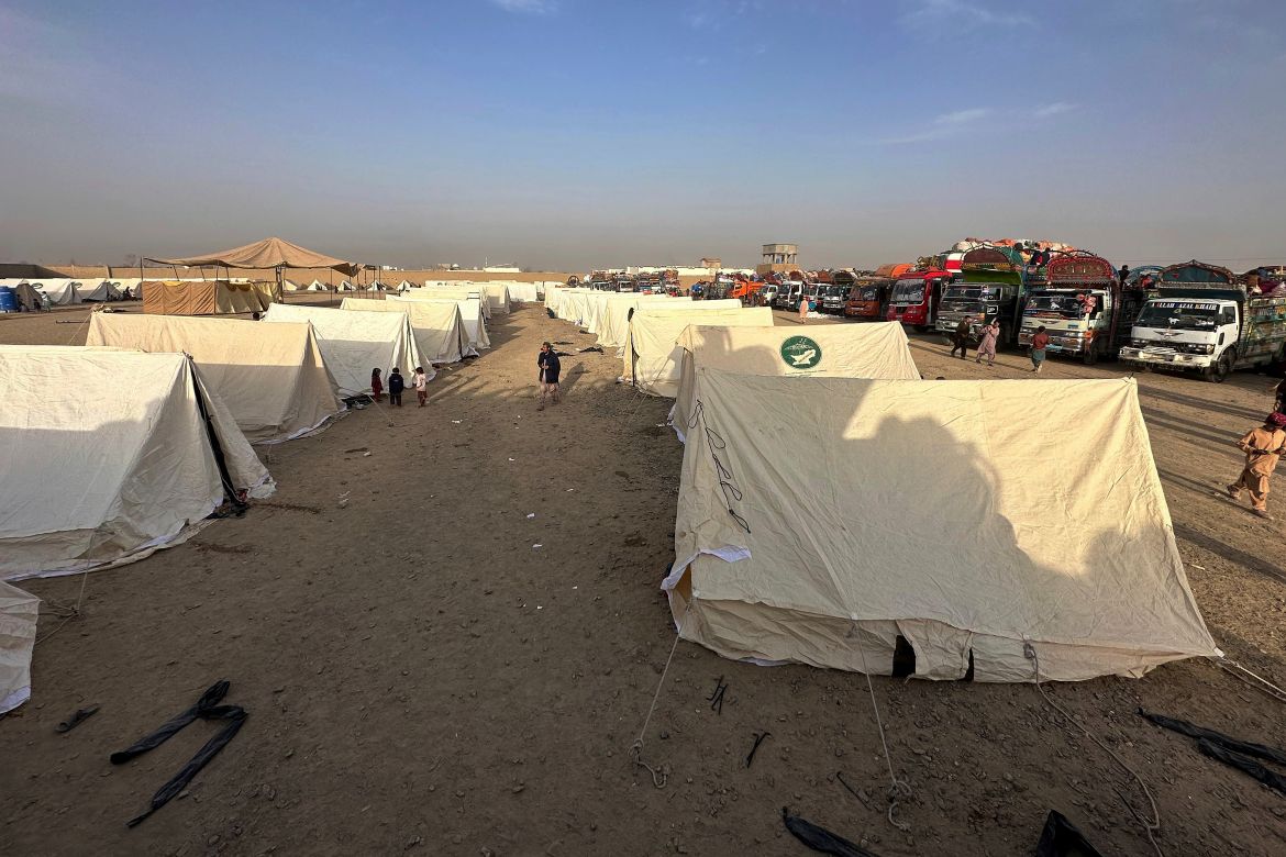 Afghans children play beside their tent as they with others wait for clearance to depart for their homeland at a deportation camp set up by authorities to facilitate illegal immigrants, in Chaman, a town on the Pakistan-Afghanistan border.