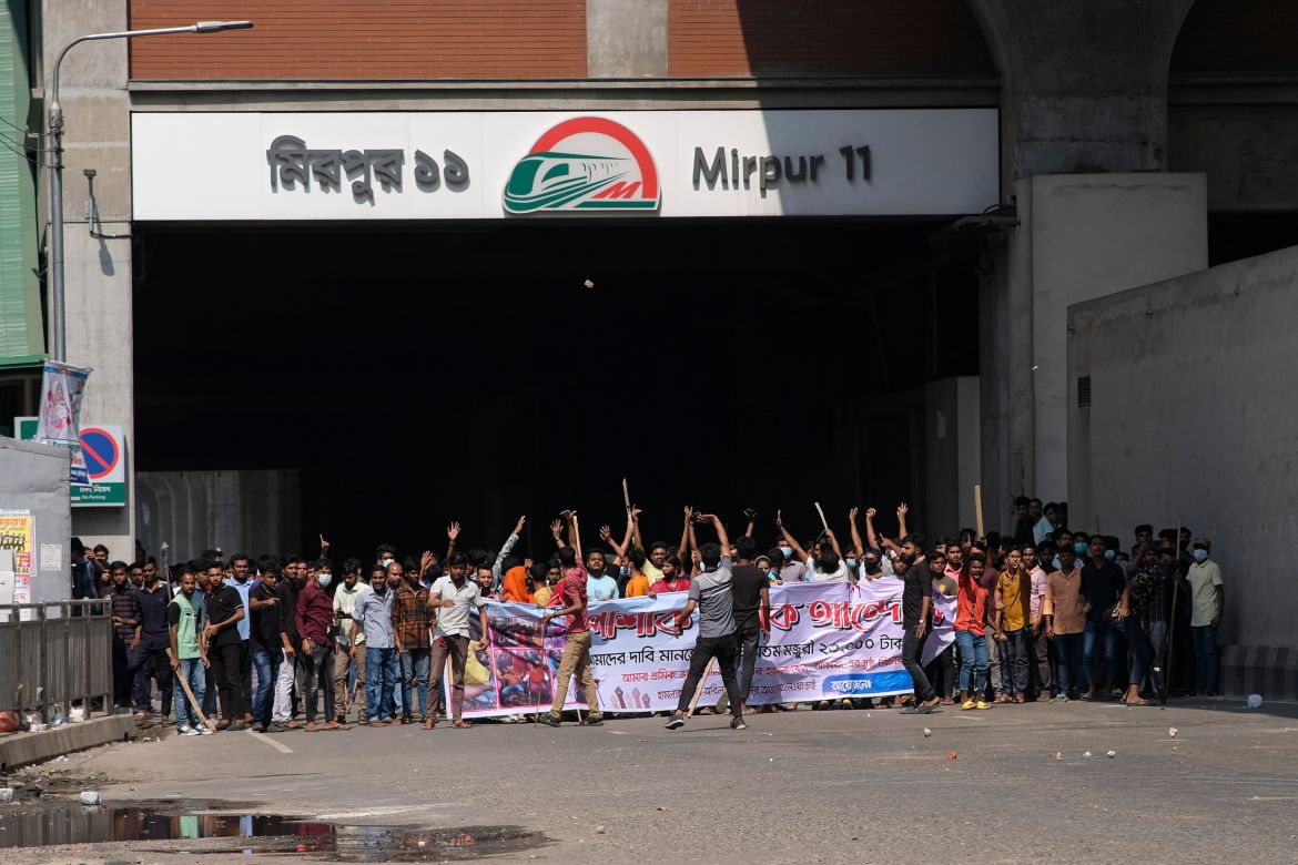 Bangladeshi garment factory workers demanding better wages block traffic at Dhaka-Mirpur area in Bangladesh.