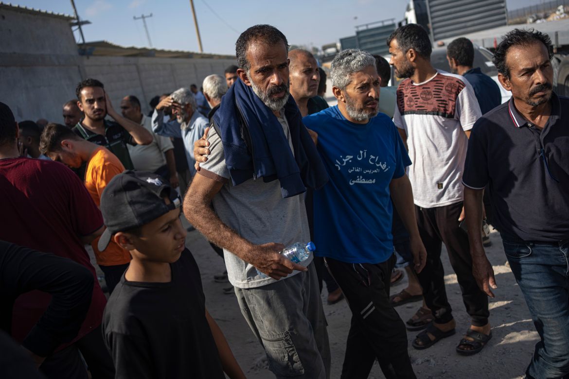 Palestinian day laborers in Israel arrive in the Gaza Strip at the Kerem Shalom crossing brought by the Israeli authorities.