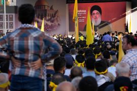 Hezbollah group listen to Hezbollah leader Sayyed Hassan Nasrallah, who addresses a speech via a video link, during a rally to commemorate Hezbollah fighters who killed in South Lebanon last few weeks while fighting against the Israeli forces, in Beirut, Lebanon, Friday, Nov. 3, 2023. Nasrallah's speech had been widely anticipated throughout the region as a sign of whether the Israel-Hamas conflict would spiral into a regional war. (AP Photo/Hussein Malla)