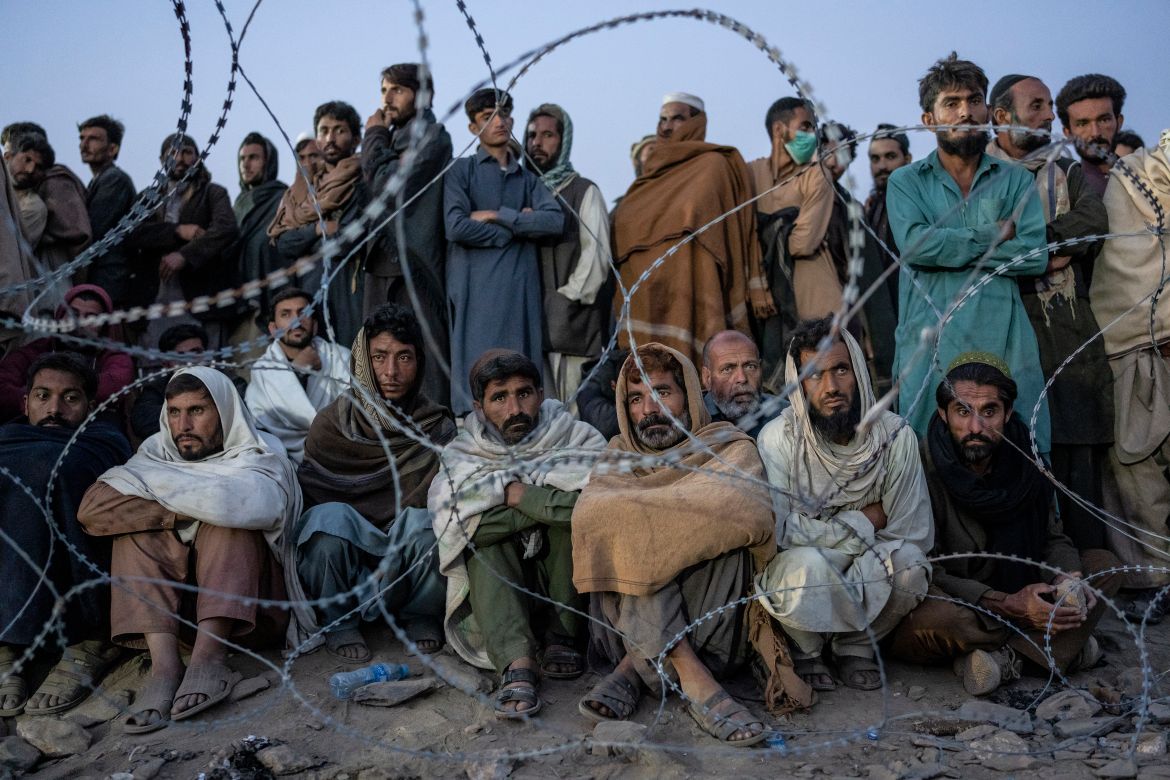 Afghan refugees wait to register in a camp near the Torkham Pakistan-Afghanistan border in Torkham, Afghanistan.