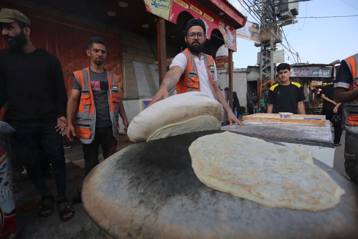 Palestinians bake bread on a street in Rafah during the ongoing Israeli bombardment of the Gaza Strip on Wednesday.