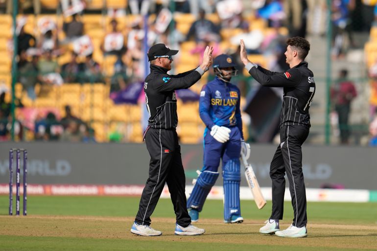 New Zealand's Mitch Santner celebrates the wicket of Sri Lanka's Dhananjaya de Silva,