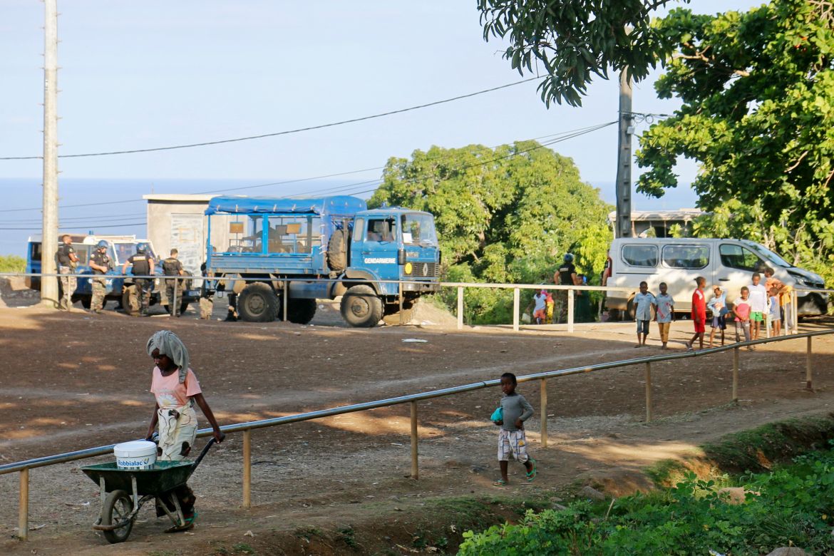 French gendarmes secure the area at a water point in M'tsamoudou, near Bandrele, on the French Indian Ocean territory of Mayotte.