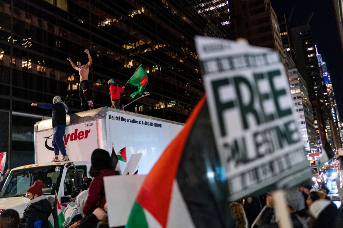 Pro-Palestinian demonstrators climb a truck while they march calling for a cease fire in Gaza, Friday, Nov. 10, 2023, in New York.