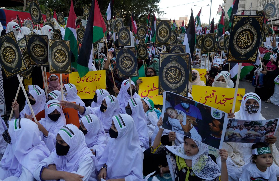 Women including young girls take part in a rally organized by religious group Darul Uloom Anwar Habib against the Israeli airstrikes on Gaza to show solidarity with Palestinian people, in Karachi, Pakistan.