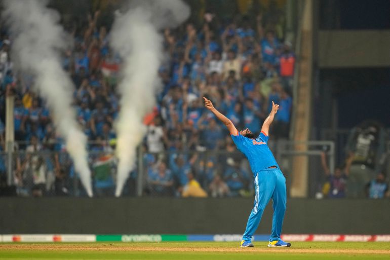 India's Mohammed Shami celebrates the wicket of New Zealand's Daryl Mitchell and also five wicket haul during the ICC Men's Cricket World Cup first semifinal match between India and New Zealand in Mumbai, India, Wednesday, Nov. 15, 2023. (AP Photo/Rafiq Maqbool)