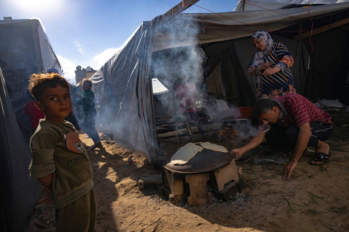 Palestinians displaced by the Israeli bombardment of the Gaza Strip prepare bread in a UNDP-provided tent camp in Khan Younis.