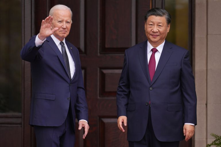 Biden and Xi at the door to the Filoli Estate. Biden is waving. They look relaxed.