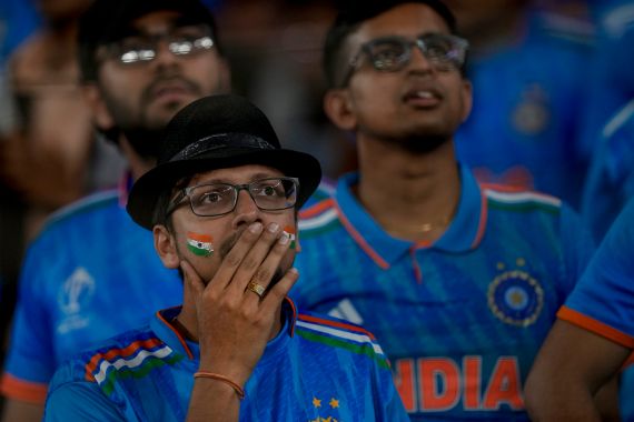 Indian fans react as the watch the ICC Men's Cricket World Cup final match between Australia and India in Ahmedabad, India.