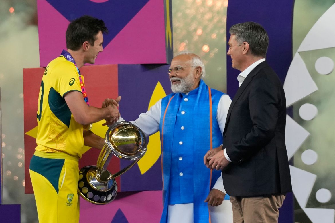 Indian Prime Minister Narendra Modi and Australian Deputy Prime Minister Richard Marles, present ICC Men's Cricket World trophy to Australia's captain Pat Cummins after Australia won against India in the final match, in Ahmedabad, India.