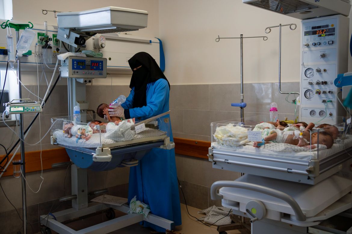 A nurse prepares premature babies for transport to Egypt after they were evacuated from Shifa Hospital in Gaza City to a hospital in Rafah