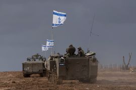 Israeli soldiers manoeuver armored military vehicles along Israel&#039;s border with the Gaza Strip, in southern Israel, on Monday, Nov. 20, 2023 [AP Photo/Ohad Zwigenberg]