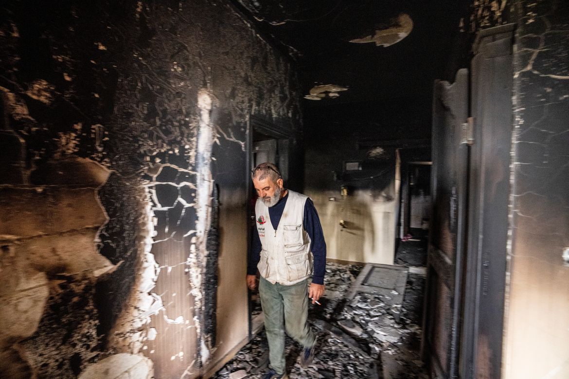 Hussein Salman inspects damages to his family house that was hit by Israeli shelling in the Kfar Kila border village with Israel in south Lebanon.