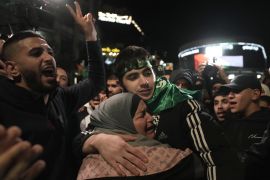 Omar Atshan, 17, is hugged by his mother after being released from an Israeli prison in the West Bank town of Ramallah, Sunday Nov. 26, 2023. Israel released 39 Palestinian prisoners in a third exchange of hostages for prisoners with Hamas Sunday. (AP Photo/Nasser Nasser)