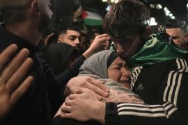 Omar Atshan, 17, is hugged by his mother after being released from an Israeli prison in the West Bank town of Ramallah as part of a detainee exchange deal between Hamas and Israel, on Sunday November 26, 2023 [AP Photo/Nasser Nasser]