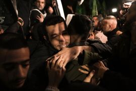 A man smiles as he is welcomed after being released from prison, in Ramallah, November 30, 2023 [Nasser Nasser/AP Photo]
