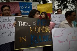 Members of Pakistan's civil society hold banners during a protest to condemn the killing of pregnant woman Farzana Parveen, who was stoned to death in Islamabad, Pakistan, Thursday, May 29, 2014. A senior police official in Pakistan said Mohammed Iqbal, husband of the woman stoned to death by her family earlier this week, was arrested for killing his first wife, though the case against him was withdrawn. Iqbals second wife was bludgeoned to death Tuesday in the eastern city of Lahore by family members. Iqbal and his wife's lawyer said the family was angry because they wanted her to marry someone else. (AP Photo/Muhammed Muheisen)
