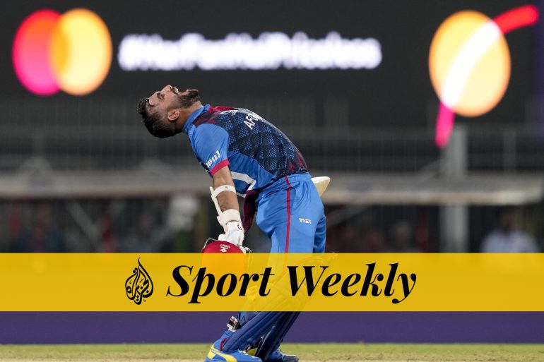 Afghanistan's captain Hashimatullah Shahidi bends backwards and screams at the sky in celebration