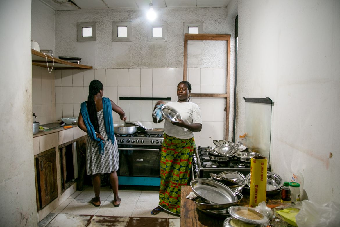 From left: Léa Agré, a librarian who sells Jewish books, assists Christiane Kona, 32, at the kitchen. Kona is a Catholic Ivorian woman who has learned how to cook kosher food as part of her job