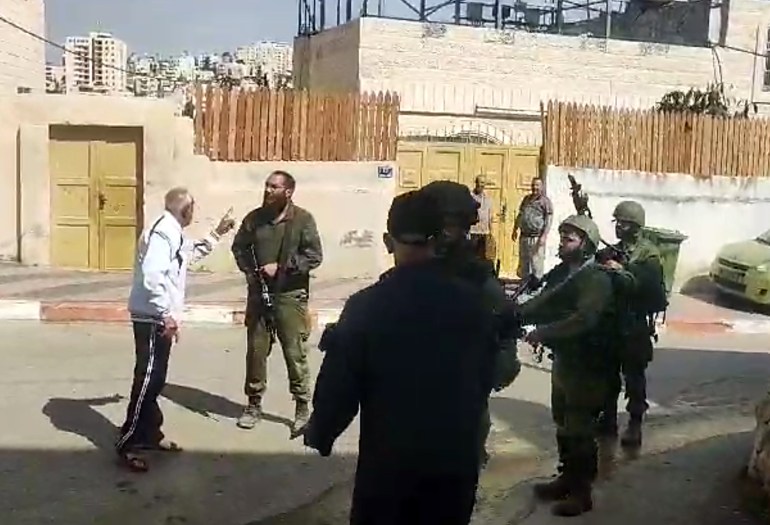 still from a video showing a confrontation
