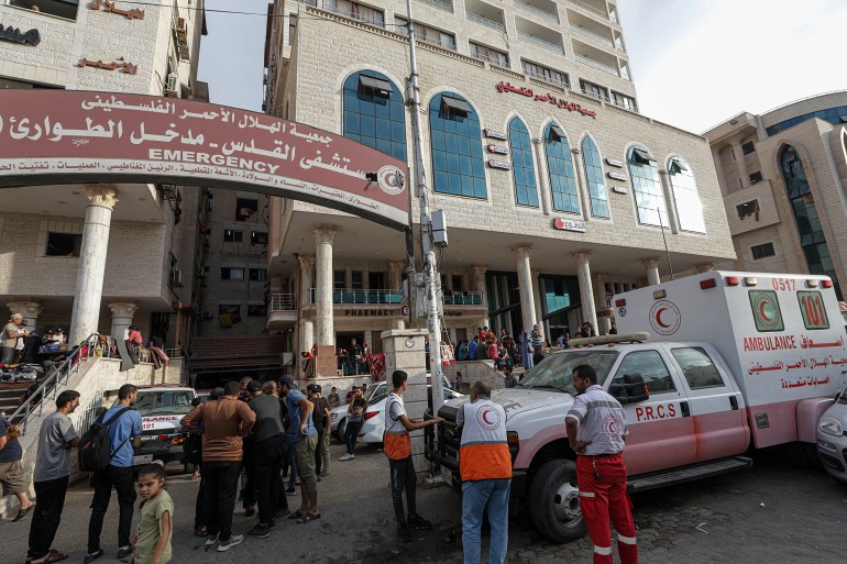 Palestinian people who fled their homes gather at the Al-Quds hospital following Israeli airstrikes on Tel al-Hawa neighborhood in Gaza City, 31 October 2023