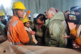 One of the trapped workers is checked out after he was rescued from the collapsed tunnel on Tuesday [Uttarkashi District Information Officer via Reuters]