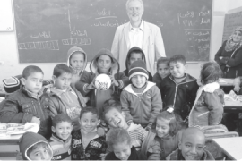 Jeremy Corbyn with Palestinian school children in a classroom in Gaza