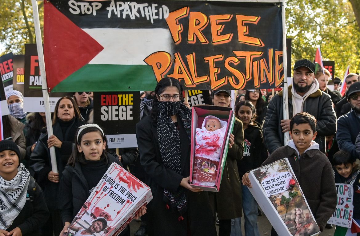 People gather in Hyde Park ahead of the Pro-Palestinian march in London, Britain