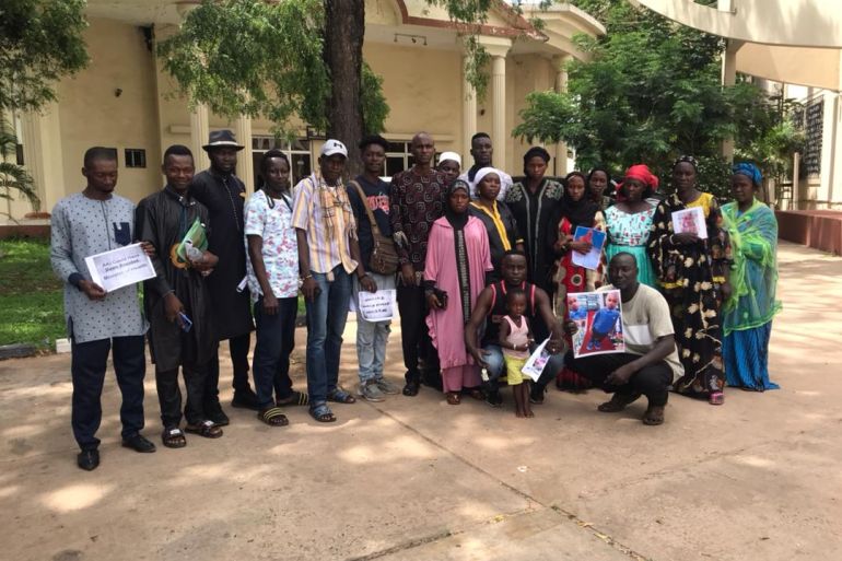 Parents of killed Gambian children pose for a photo at a meeting