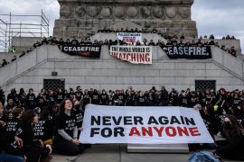 Activists from Jewish Voice for Peace occupy the pedestal of the Statue of Liberty on November 6, 2023 in New York City. The group has been occupying high profile New York City locations calling for a ceasefire in Gaza [Stephanie Keith/Getty Images/AFP]
